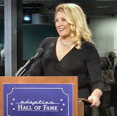 Click to enlarge Delilah accepts the Adoption Hall of Fame Award