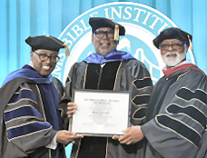 Click to enlarge L-R: Bishop Stan Williams, Mike Chandler, and Academic Dean Dr. Van Gayton